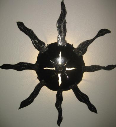 upcycled plough disc wall light